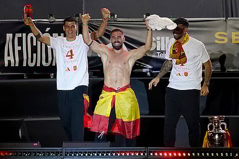 Alvaro Morata, Dani Carvajal and goalkeeper David Raya